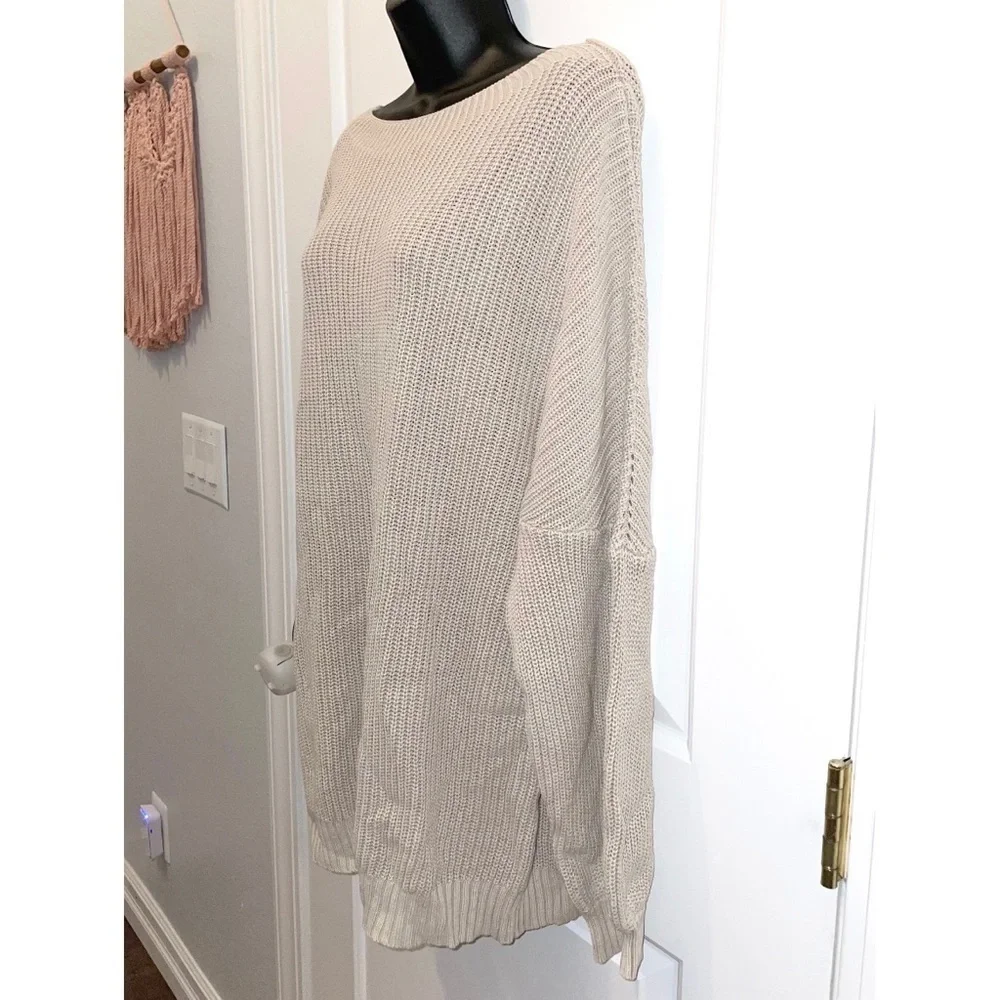 Mazik textured knit sweater features a soft beige/ivory color and a relaxed fit